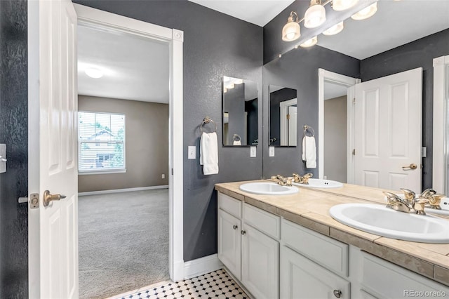 10646 Amesbury Way, Highlands Ranch, CO 80126 - bathroom featuring baseboards and double vanity