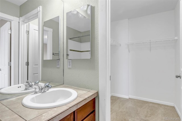 10646 Amesbury Way, Highlands Ranch, CO 80126 - full bathroom with vanity and a walk in closet