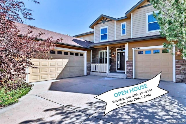 10646 Amesbury Way, Highlands Ranch, CO 80126 - view of front of house with stone siding, covered porch, concrete driveway, and a garage