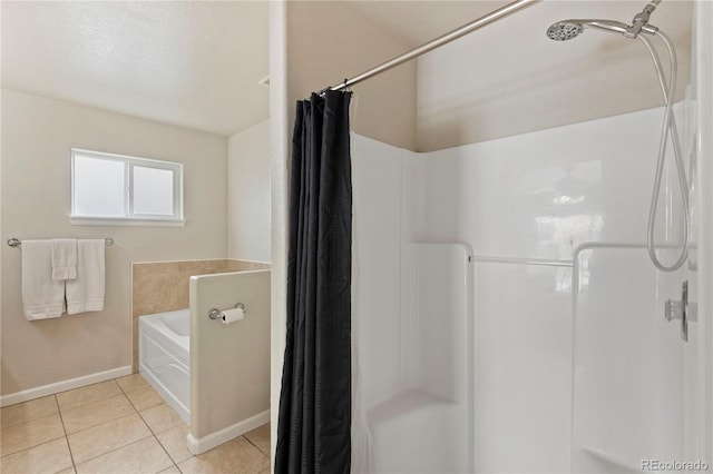 bathroom featuring independent shower and bath, tile patterned flooring, and a textured ceiling