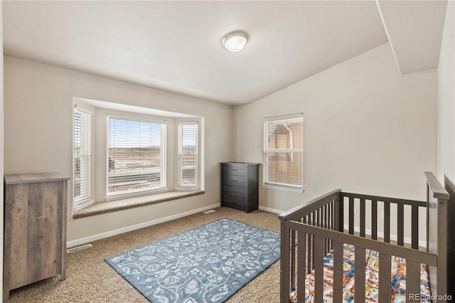 carpeted bedroom featuring vaulted ceiling