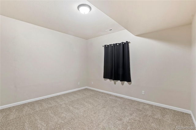 unfurnished room featuring carpet