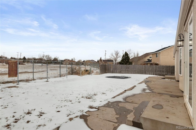 view of yard layered in snow