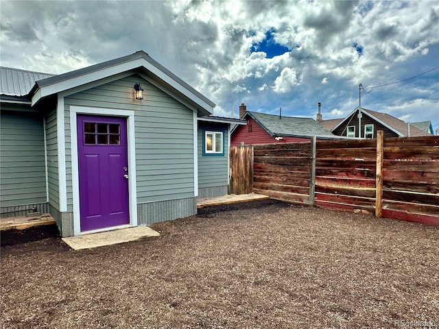 view of outdoor structure with fence