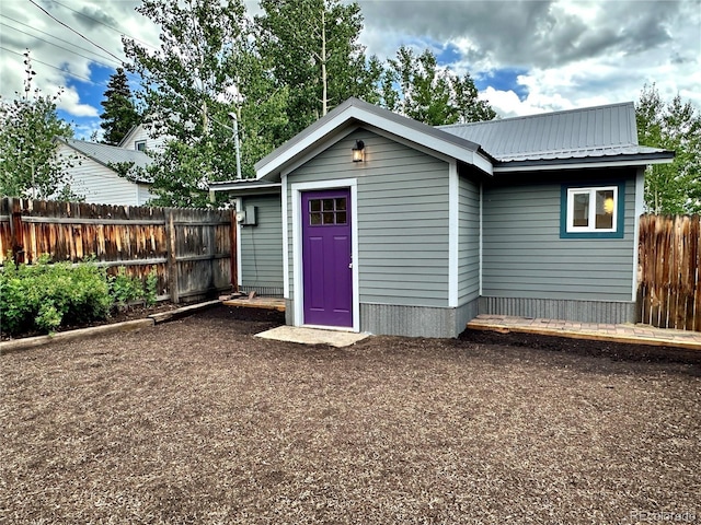 view of outdoor structure featuring fence