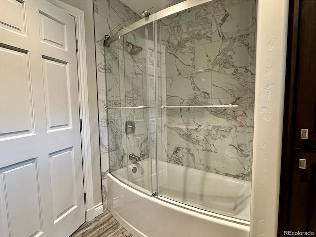 full bathroom featuring wood finished floors and enclosed tub / shower combo