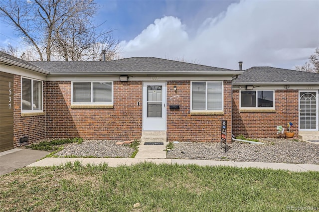 1537 Xenia St, Denver, CO 80220 - view of front of house featuring brick siding, roof with shingles, and entry steps