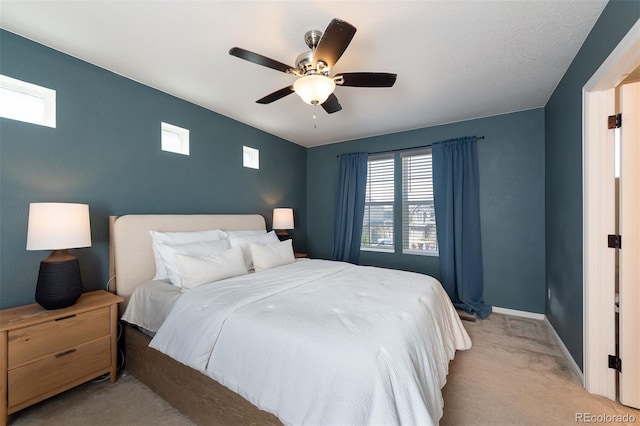 carpeted bedroom with ceiling fan