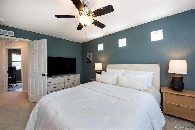 carpeted bedroom with ceiling fan