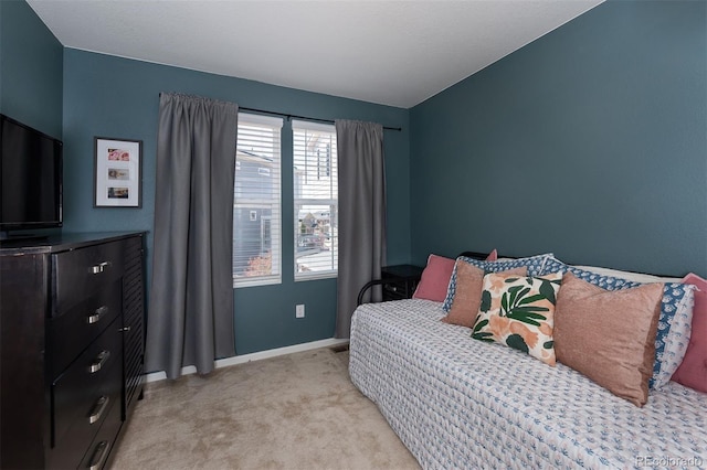 bedroom featuring light carpet