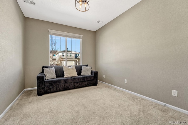 living area featuring light colored carpet