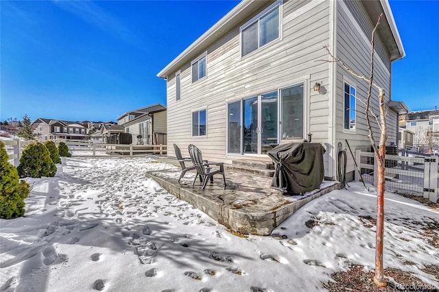 view of snow covered house