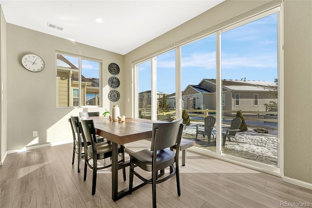 1886 Makley Loop, Castle Rock, CO 80104 - dining space featuring wood finished floors, baseboards, and plenty of natural light