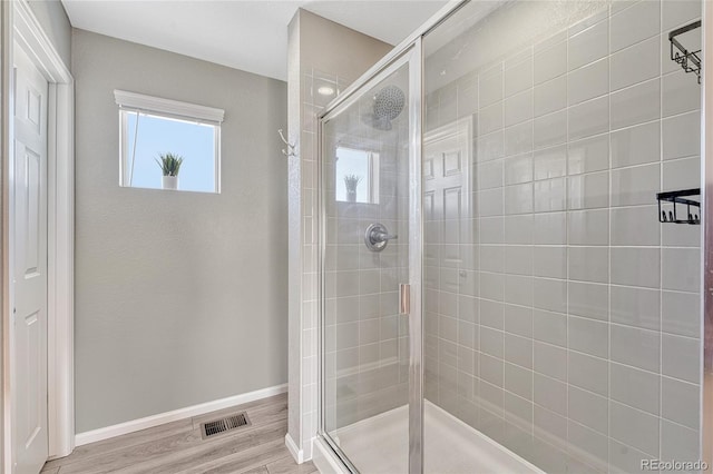 1886 Makley Loop, Castle Rock, CO 80104 - full bath with a shower stall, wood finished floors, and baseboards