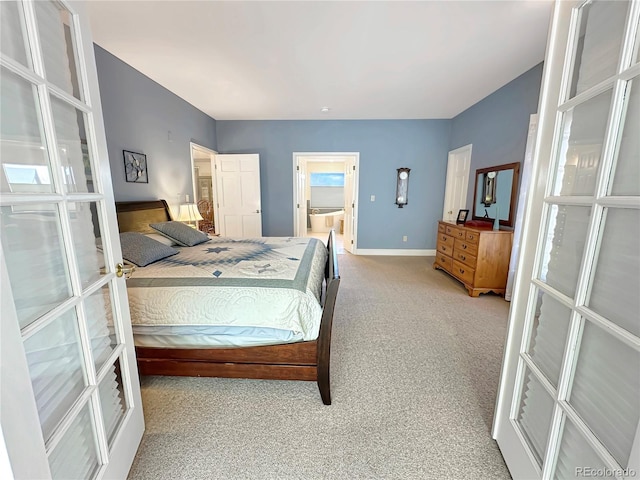 carpeted bedroom featuring connected bathroom, french doors, and baseboards