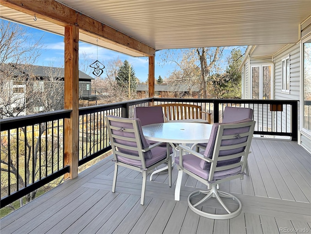 wooden terrace with outdoor dining area