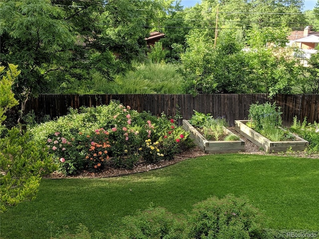 view of yard featuring a garden and fence