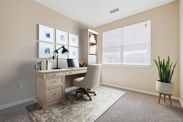 carpeted home office featuring baseboards and visible vents