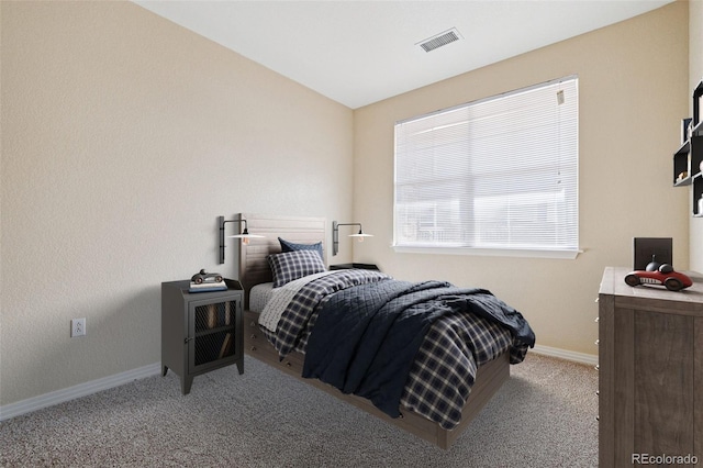 bedroom with light carpet, baseboards, visible vents, and vaulted ceiling