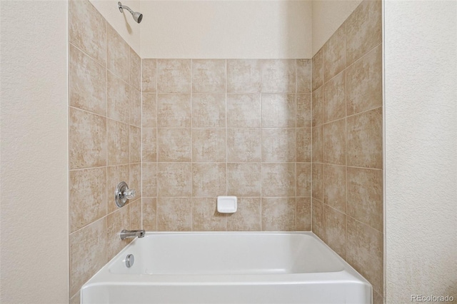 bathroom with shower / tub combination