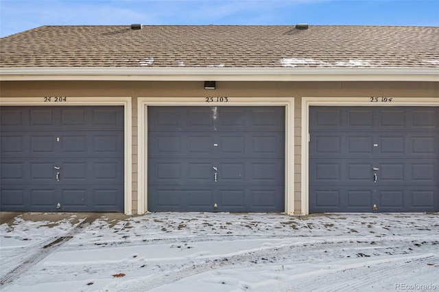 view of snow covered garage