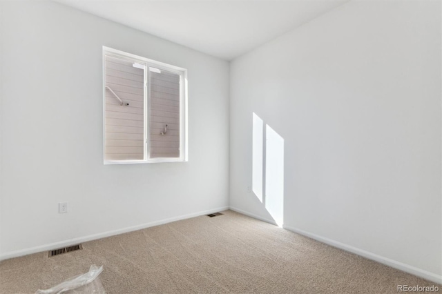 unfurnished room with carpet floors