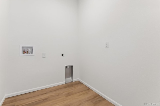 washroom featuring hookup for an electric dryer, hookup for a washing machine, and hardwood / wood-style flooring