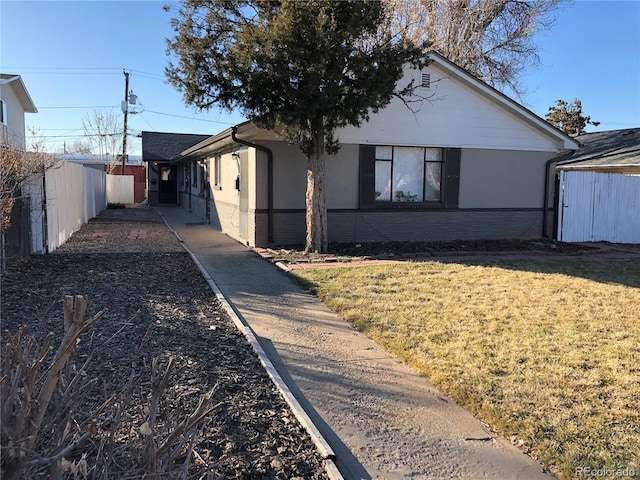 1143 Akron St, Aurora, CO 80010 - single story home with brick siding and stucco siding