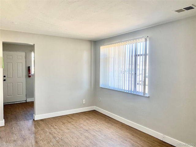 1143 Akron St, Aurora, CO 80010 - empty room featuring baseboards and wood finished floors