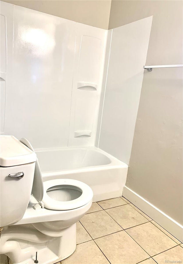 1143 Akron St, Aurora, CO 80010 - full bath featuring tile patterned floors, toilet, and baseboards
