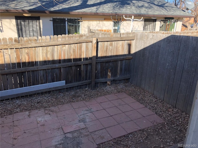 1143 Akron St, Aurora, CO 80010 - view of patio featuring a fenced backyard