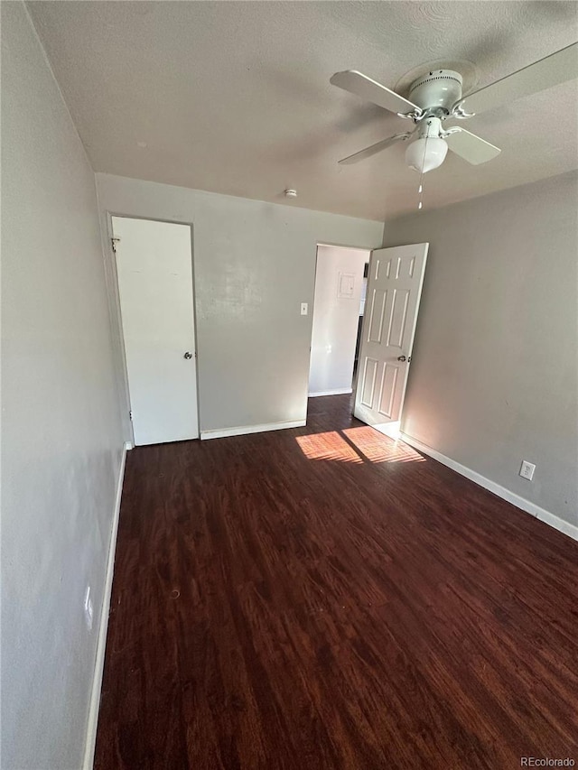 1143 Akron St, Aurora, CO 80010 - empty room featuring wood finished floors, a ceiling fan, and baseboards