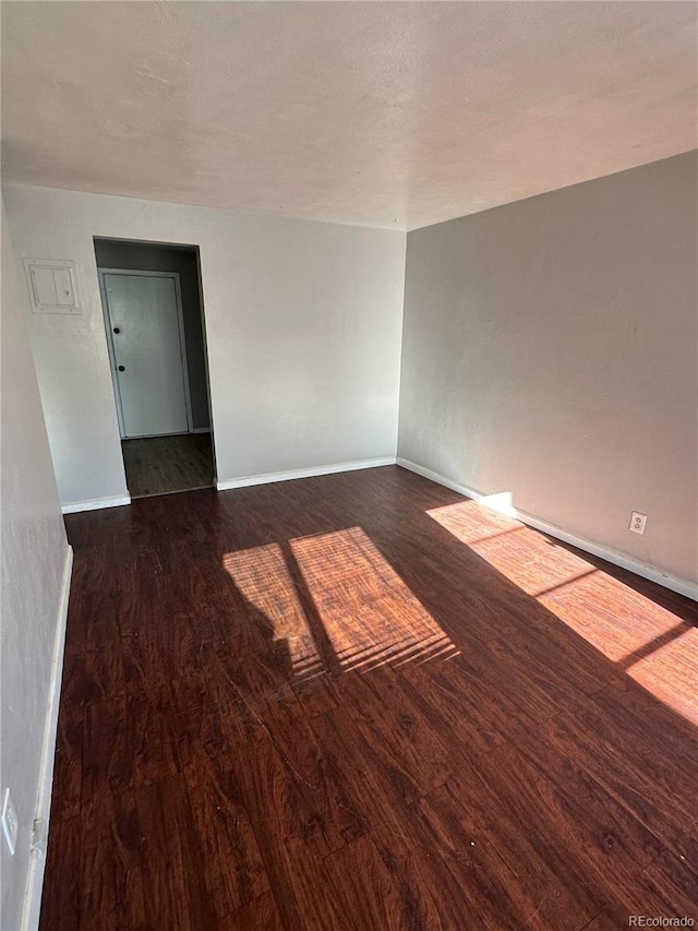 1143 Akron St, Aurora, CO 80010 - empty room featuring wood finished floors and baseboards