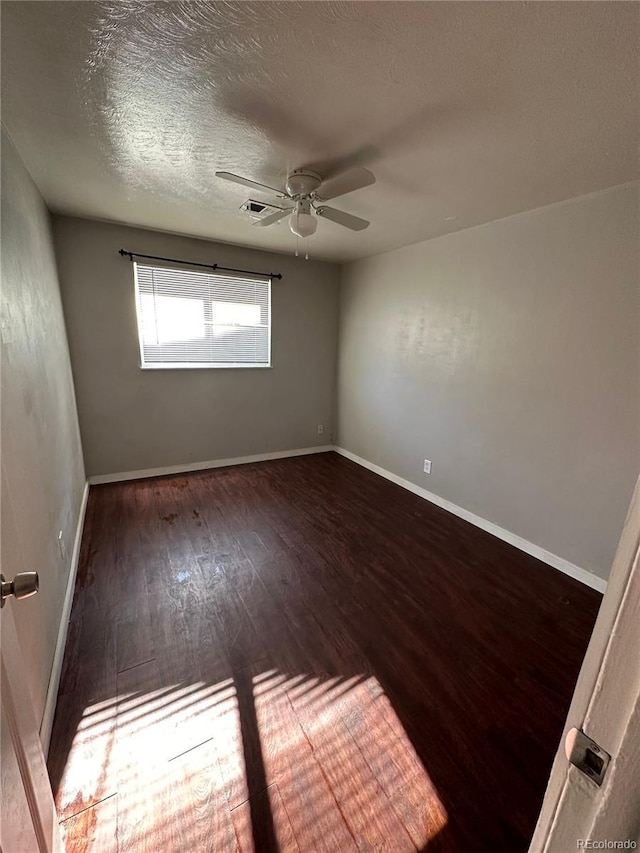 1143 Akron St, Aurora, CO 80010 - spare room with wood finished floors, a ceiling fan, and baseboards