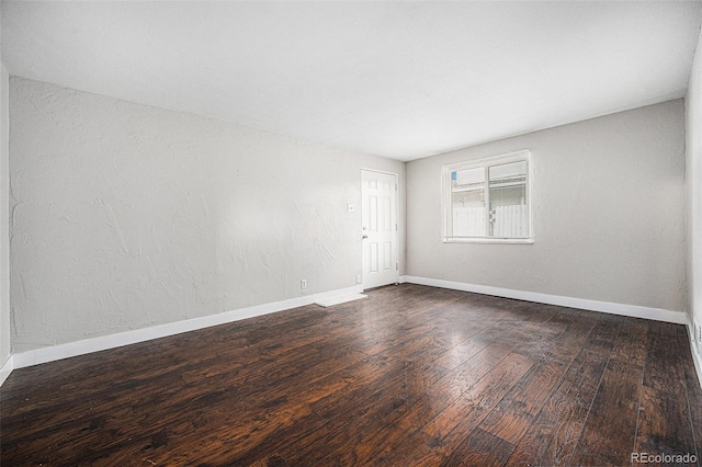 1143 Akron St, Aurora, CO 80010 - spare room with wood finished floors and baseboards