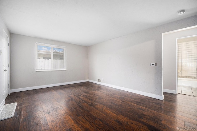 1143 Akron St, Aurora, CO 80010 - spare room with hardwood / wood-style floors, a smoke detector, and baseboards