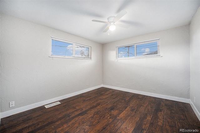 1143 Akron St, Aurora, CO 80010 - unfurnished room featuring ceiling fan, baseboards, and dark wood-style floors