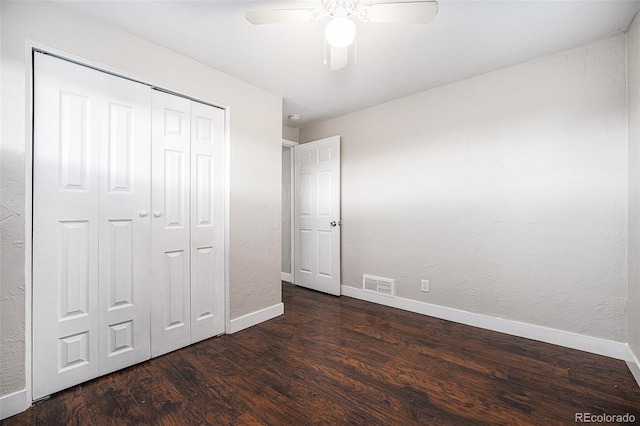 1143 Akron St, Aurora, CO 80010 - unfurnished bedroom with wood finished floors, baseboards, a closet, and a ceiling fan