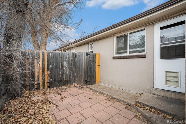 1143 Akron St, Aurora, CO 80010 - view of patio featuring fence