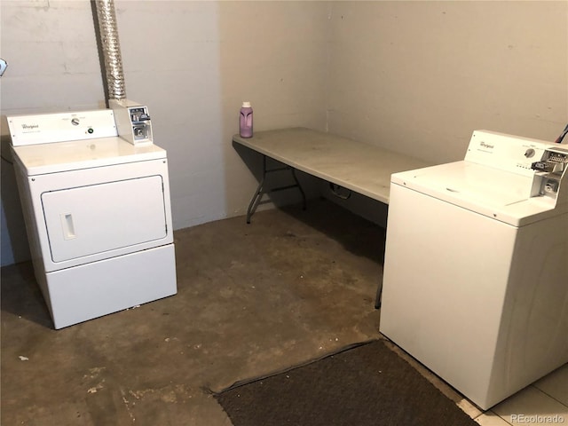1143 Akron St, Aurora, CO 80010 - washroom featuring independent washer and dryer and concrete block wall