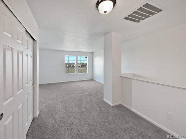 12713 Leyden St Unit E, Thornton, CO 80602 - carpeted empty room featuring baseboards