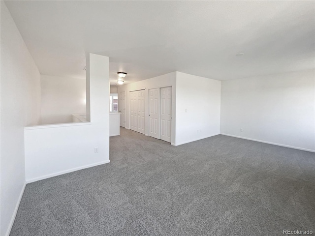 12713 Leyden St Unit E, Thornton, CO 80602 - carpeted empty room featuring baseboards