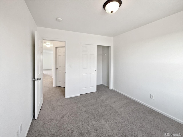 12713 Leyden St Unit E, Thornton, CO 80602 - unfurnished bedroom with carpet floors, baseboards, and a closet