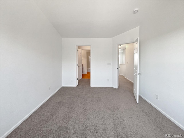 12713 Leyden St Unit E, Thornton, CO 80602 - unfurnished bedroom featuring carpet floors and baseboards