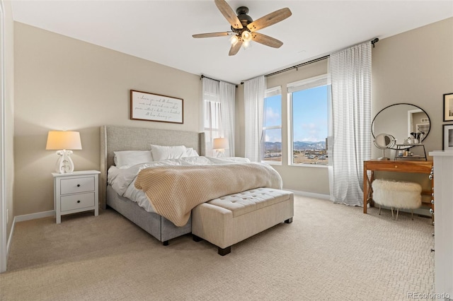 bedroom featuring ceiling fan and light colored carpet