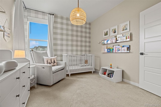 carpeted bedroom with a crib