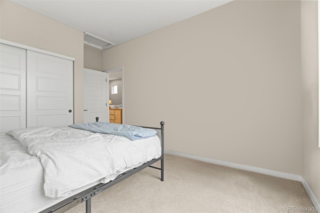 carpeted bedroom with a closet