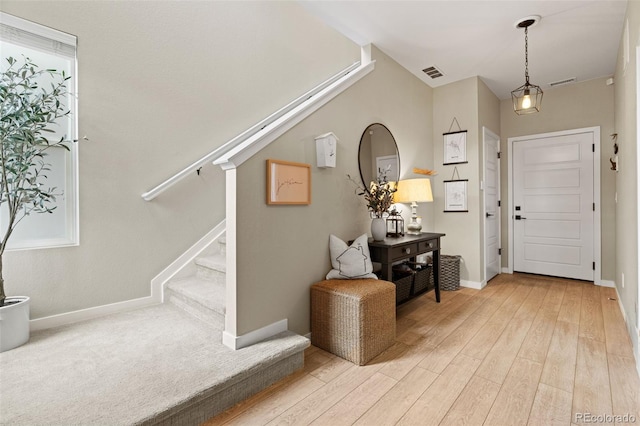 foyer entrance with hardwood / wood-style flooring