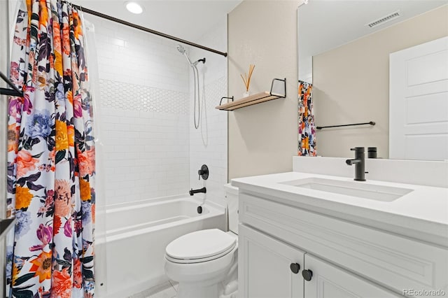 full bathroom with vanity, toilet, and shower / tub combo with curtain