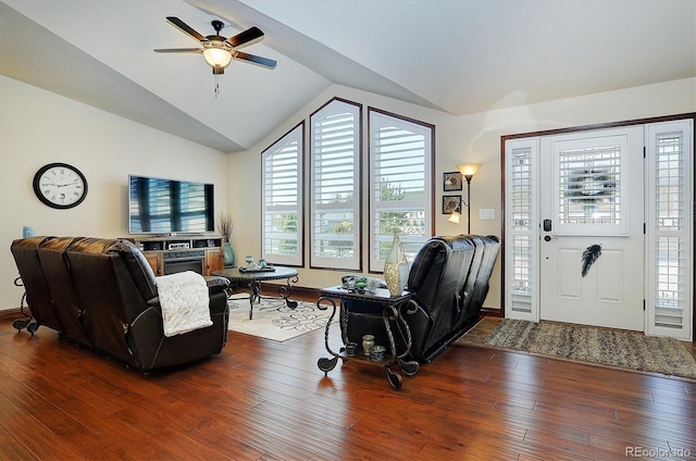 living room featuring hardwood / wood-style floors, vaulted ceiling, and plenty of natural light